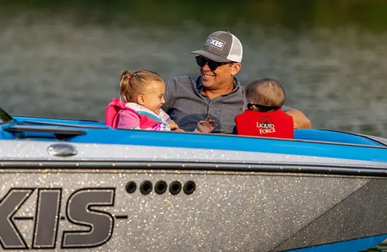father and children on Axis boat