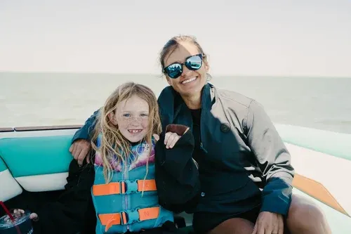 a lady and a girl on a boat
