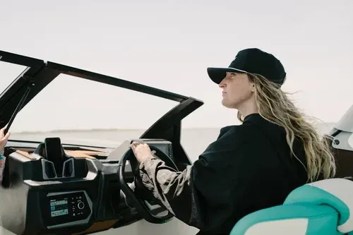 Lady driving a boat