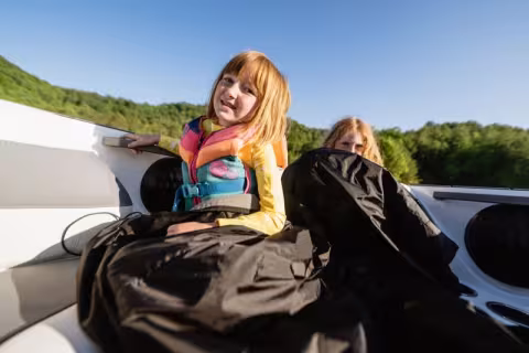 kids in a boat